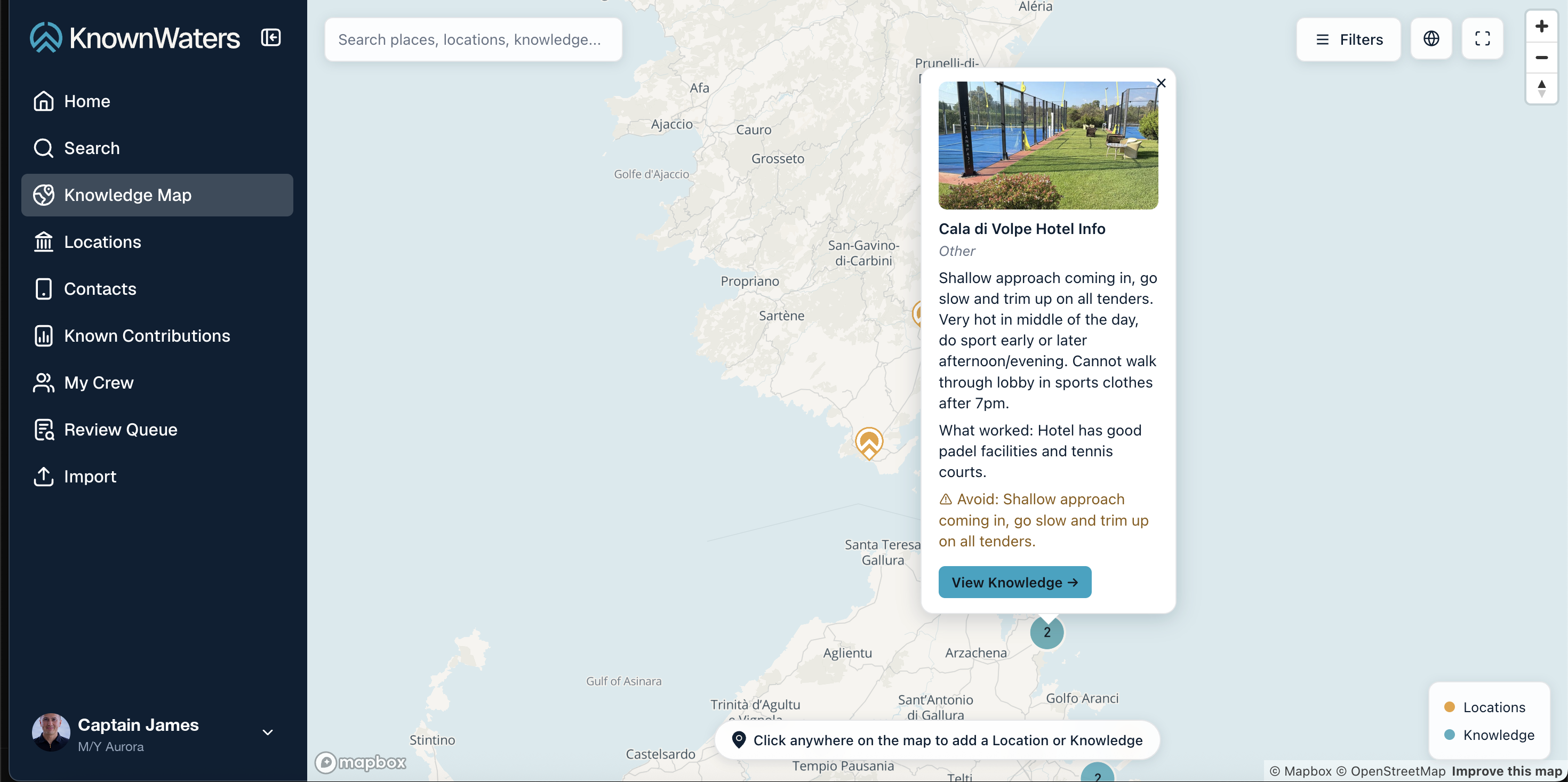 KnownWaters Knowledge Map showing location and knowledge pins across the coastline, an open knowledge card for Cala di Volpe Hotel with approach notes and things to avoid, the map search bar, filters, and the Locations/Knowledge legend